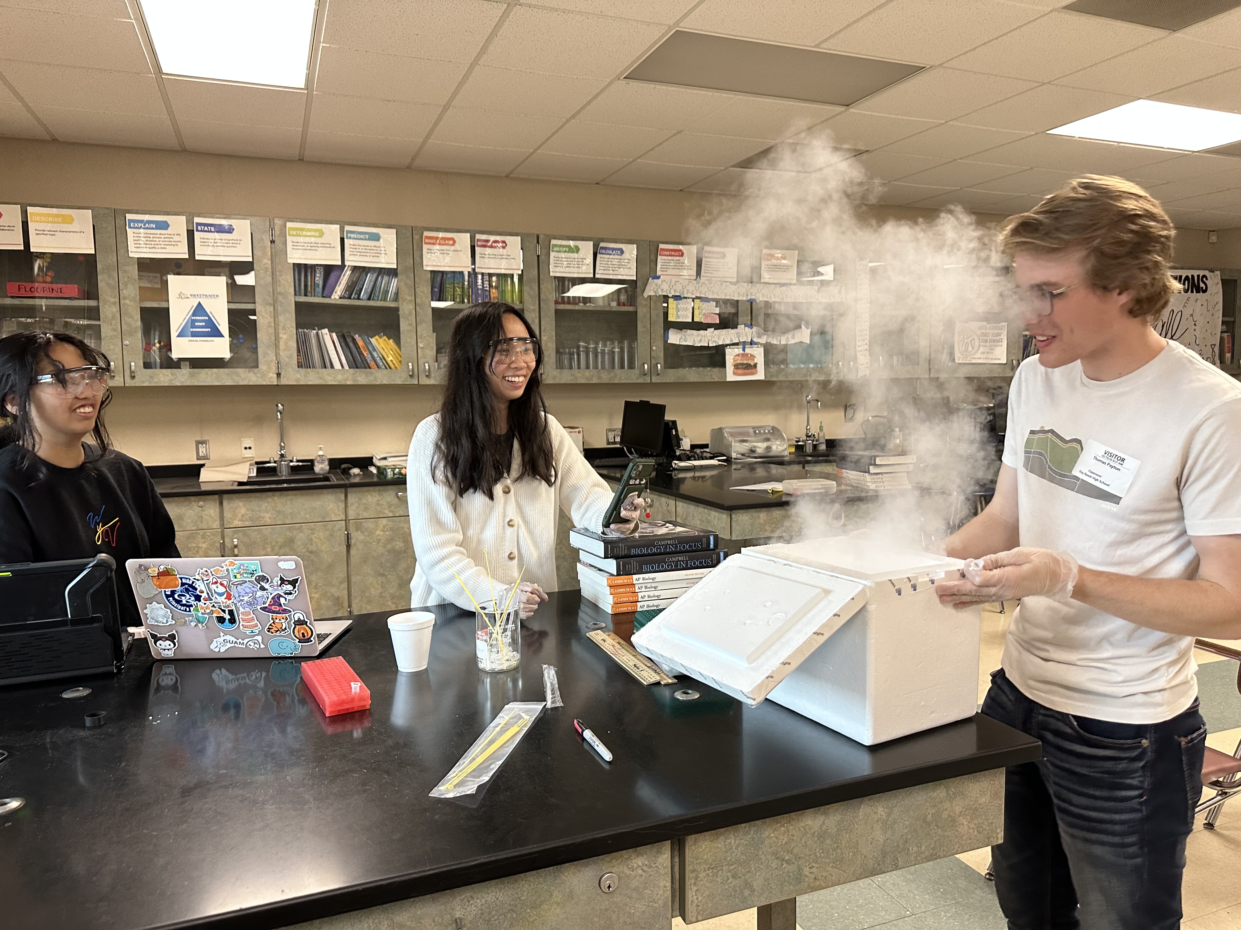 Payton giving competent cells to students - we store the comp cells on dry ice